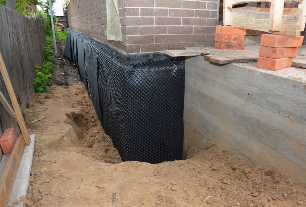 Happy homeowners after waterproofing job in Clarklake